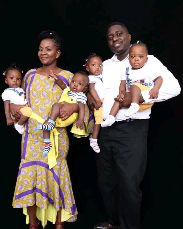 Adults and children posing together