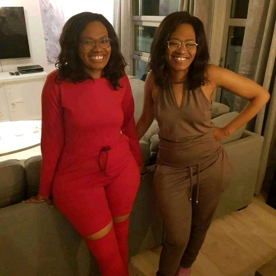 Two women posing together indoors
