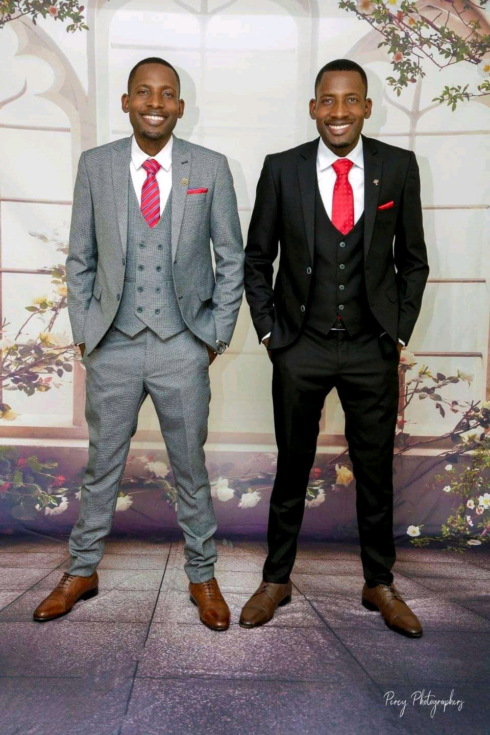 Two men in suits and red ties